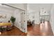 Open entryway with hardwood floors leading to the formal dining room and living area at 1822 Painter Dr, Monument, CO 80132