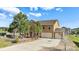 Beautifully landscaped home features a spacious three-car garage and stunning stone entryway at 1822 Painter Dr, Monument, CO 80132