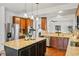 Modern kitchen featuring stainless steel appliances, island with seating, and hardwood floors at 1822 Painter Dr, Monument, CO 80132