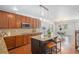 Well-equipped kitchen with modern appliances, granite countertops, and a center island with seating at 1822 Painter Dr, Monument, CO 80132