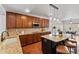 Modern kitchen features granite countertops, stainless steel appliances, hardwood floors, and a stylish island at 1822 Painter Dr, Monument, CO 80132