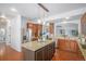 Gourmet kitchen features stainless steel appliances, granite countertops, and custom cabinetry at 1822 Painter Dr, Monument, CO 80132