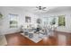 Inviting living room featuring bright windows, hardwood floors, and a stylish seating area at 1822 Painter Dr, Monument, CO 80132