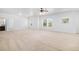 Large living room with neutral carpet and plenty of space for different furniture arrangements at 1822 Painter Dr, Monument, CO 80132