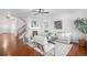Bright living room features a fireplace, hardwood floors, and modern decor at 1822 Painter Dr, Monument, CO 80132