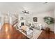 Bright living room features a fireplace, hardwood floors, comfortable seating, and ample natural light at 1822 Painter Dr, Monument, CO 80132