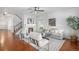 Cozy living room featuring a fireplace, modern furniture, and hardwood floors at 1822 Painter Dr, Monument, CO 80132
