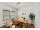 Bright home office with a wood desk, chair, and natural light from the window at 1822 Painter Dr, Monument, CO 80132