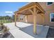 Outdoor patio with wooden pergola and string lights for entertaining at 1822 Painter Dr, Monument, CO 80132