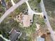 Stunning aerial view of a home featuring lush landscaping, an inviting patio, and a private outdoor space at 440 Scrub Oak Cir, Monument, CO 80132