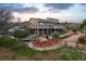 Stunning backyard with a large deck, mature trees, and landscaped yard at 440 Scrub Oak Cir, Monument, CO 80132