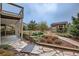 Backyard with terraced gardens and a storage shed at 440 Scrub Oak Cir, Monument, CO 80132