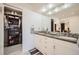 Bathroom featuring a double vanity, modern finishes, and a walk-in closet at 440 Scrub Oak Cir, Monument, CO 80132