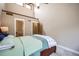 Bright bedroom featuring high ceilings, natural light, and soft carpeting at 440 Scrub Oak Cir, Monument, CO 80132
