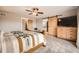 Well-lit bedroom showcasing a barn door, neutral walls, and soft carpet at 440 Scrub Oak Cir, Monument, CO 80132