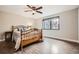 Cozy bedroom with a wood-frame bed and a large window at 440 Scrub Oak Cir, Monument, CO 80132