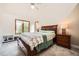 Comfortable bedroom with a large window, window seat, and matching bedside tables at 440 Scrub Oak Cir, Monument, CO 80132