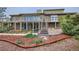 Back exterior of house with multiple decks and garden area at 440 Scrub Oak Cir, Monument, CO 80132