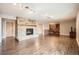 Spacious living room featuring a stone fireplace and wood flooring at 440 Scrub Oak Cir, Monument, CO 80132
