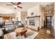 Cozy living room with fireplace and stone mantle at 440 Scrub Oak Cir, Monument, CO 80132