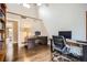 Spacious office space featuring hardwood floors, ample desks, and natural light at 440 Scrub Oak Cir, Monument, CO 80132