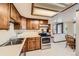 Functional kitchen with stainless steel appliances, ample counter space, and wooden cabinets at 5046 S Evanston St, Aurora, CO 80015