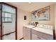 Functional laundry room with washer, dryer, and world map wall decor at 5046 S Evanston St, Aurora, CO 80015