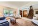Cozy living room with a bay window seat and a staircase leading to the upper level at 5046 S Evanston St, Aurora, CO 80015