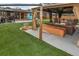 Backyard featuring a gazebo, outdoor kitchen and patio seating with outdoor furniture at 11964 W 71St Pl, Arvada, CO 80004