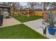 Beautiful backyard featuring a gazebo, artificial turf, outdoor kitchen, and lounge area at 11964 W 71St Pl, Arvada, CO 80004