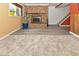 Basement Gathering room features a charming brick fireplace, enhancing the cozy atmosphere at 11964 W 71St Pl, Arvada, CO 80004