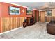 Basement Gathering room includes a flat-screen television and comfortable seating at 11964 W 71St Pl, Arvada, CO 80004