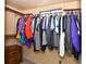 Walk-in closet features an assortment of hanging clothes at 11964 W 71St Pl, Arvada, CO 80004
