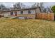 Home exterior showcasing the lawn and brick features that adds texture and character at 11964 W 71St Pl, Arvada, CO 80004