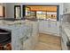 Well-appointed kitchen featuring granite countertops, stainless steel appliances, and ample cabinet space at 11964 W 71St Pl, Arvada, CO 80004