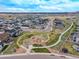 Aerial view of the community featuring a green space with a playground and walking trails at 4925 Coltin Trl, Castle Rock, CO 80104