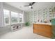 Bright bedroom with dinosaur-themed wallpaper, three large windows, bench and ceiling fan at 4925 Coltin Trl, Castle Rock, CO 80104