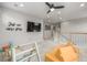 Spacious bonus room with play area, large TV, and a cozy lounge area for relaxation at 4925 Coltin Trl, Castle Rock, CO 80104