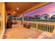 Cozy covered patio with comfortable seating, fire pit, and views of the surrounding neighborhood at 4925 Coltin Trl, Castle Rock, CO 80104