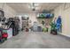 Spacious garage with ample storage, including shelves and hanging racks for organized utility at 4925 Coltin Trl, Castle Rock, CO 80104