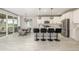 Bright, open kitchen with stainless appliances, a large island, and sliding doors to the deck at 4925 Coltin Trl, Castle Rock, CO 80104