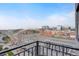 Balcony view of the city featuring a bridge, buildings, and blue sky at 1521 Central St # 3C, Denver, CO 80211