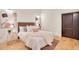 Cozy bedroom featuring hardwood floors, neutral color scheme, and comfortable furnishings at 1521 Central St # 3C, Denver, CO 80211