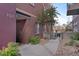 Building entrance with a landscaped walkway, brick facade, and prominent address number at 1521 Central St # 3C, Denver, CO 80211