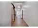 A well-lit hallway with multiple doors leading to different units at 1521 Central St # 3C, Denver, CO 80211