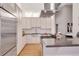 Contemporary kitchen with stainless steel appliances, sleek countertops, and custom cabinetry at 1521 Central St # 3C, Denver, CO 80211
