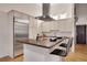 Modern kitchen featuring stainless steel appliances, a large island, and ample cabinet space at 1521 Central St # 3C, Denver, CO 80211