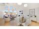 Living room with modern furniture, city views, and open layout to the dining area at 1521 Central St # 3C, Denver, CO 80211