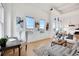 Bright living room showcasing tall ceilings, large windows, and modern decor at 1521 Central St # 3C, Denver, CO 80211