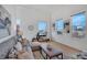 Bright living room features tall ceilings, large windows, and modern decor at 1521 Central St # 3C, Denver, CO 80211